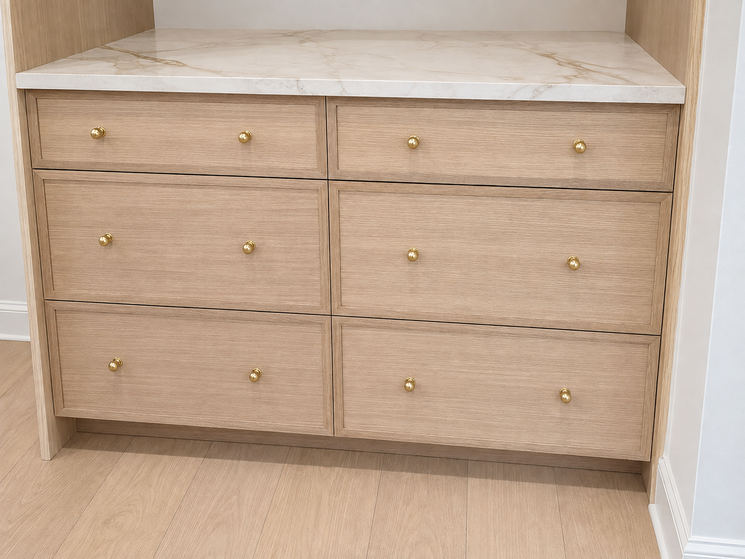 White oak drawers finished with marble and brass details